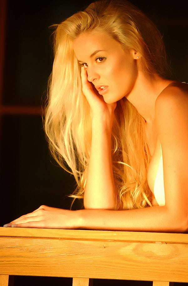 Blond girl staring ahead with the evening light upon her. Picture from Depositphotos.com