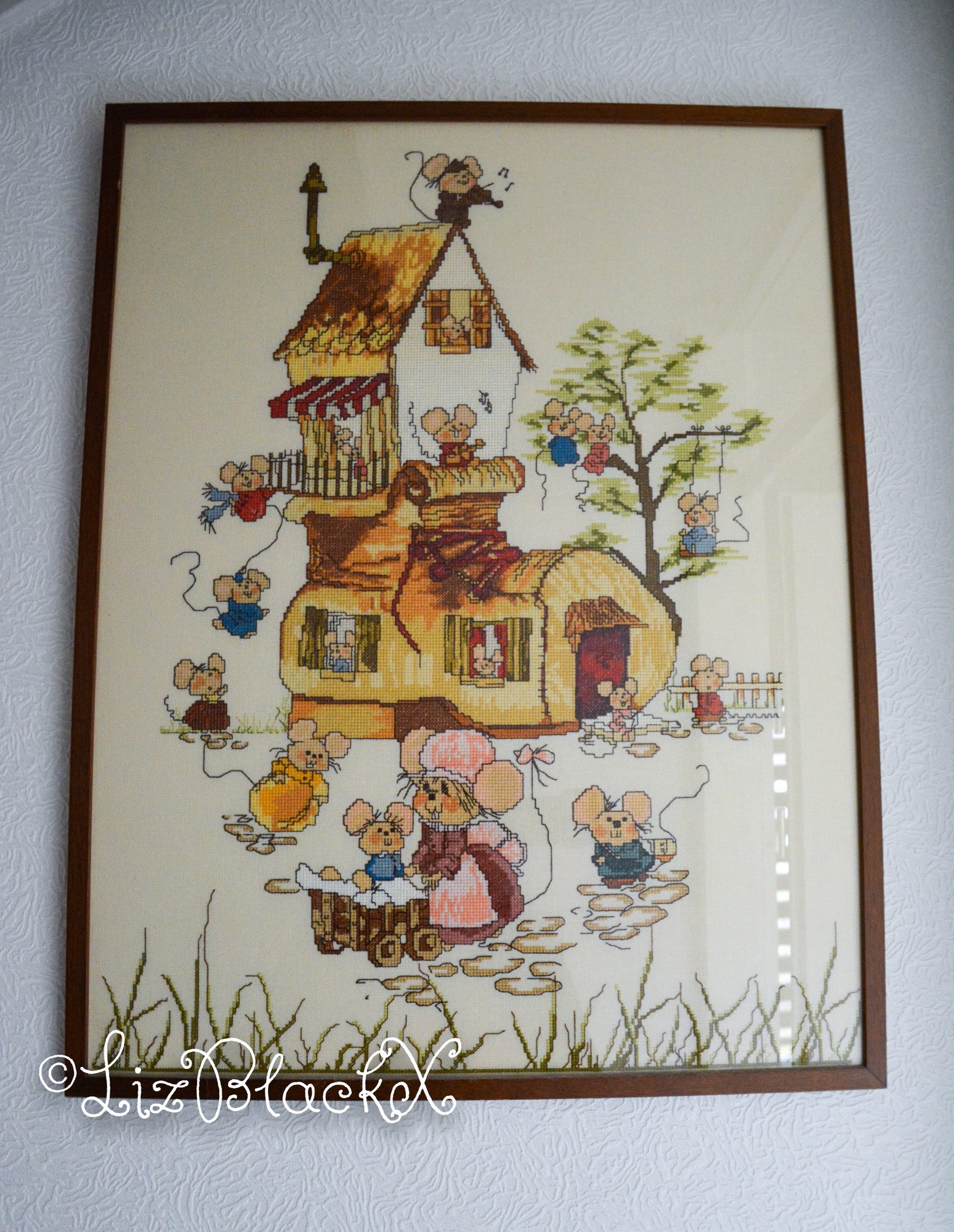 Cross-stitch work of house with mice
Copyright Liz BlackX