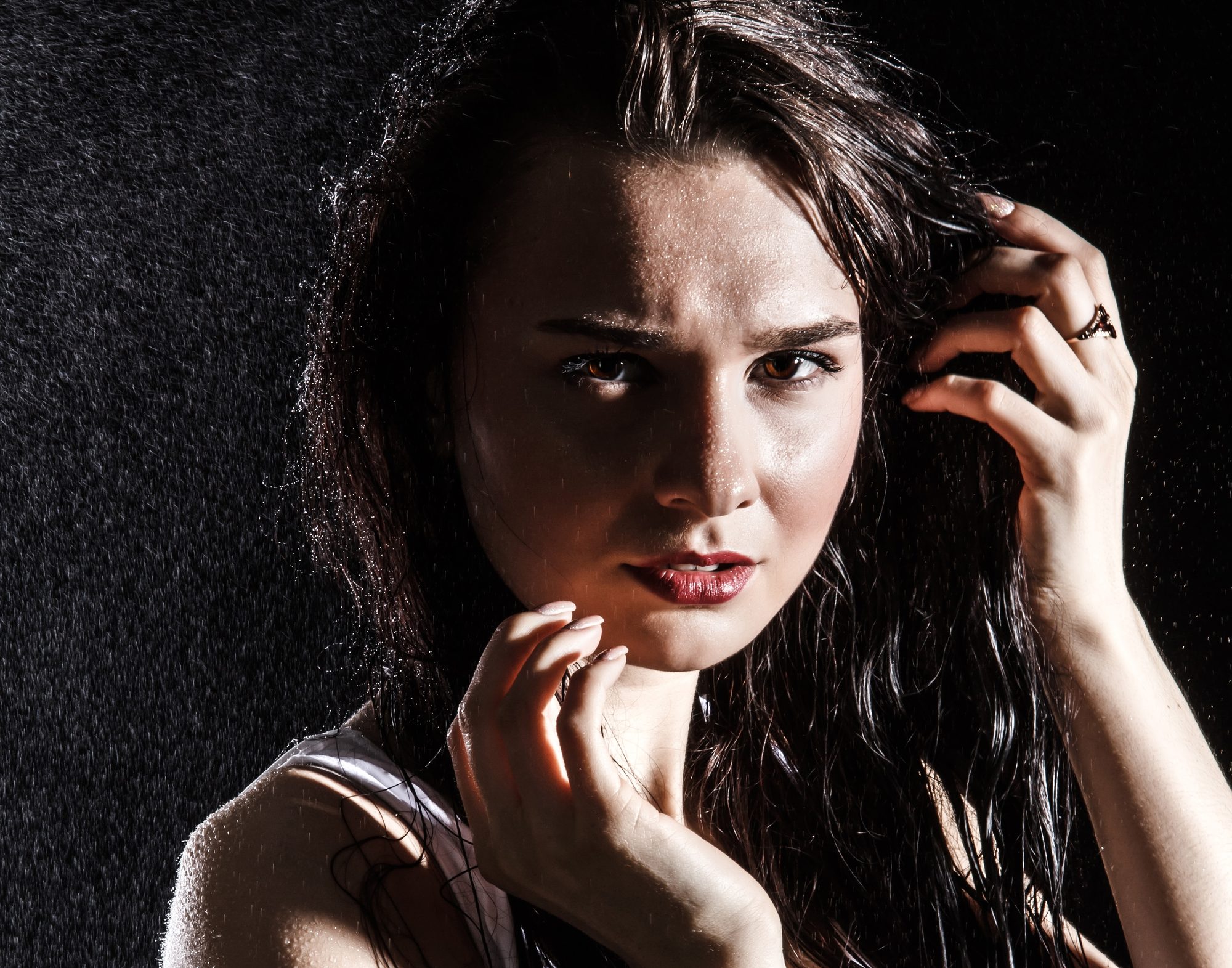 Dark haired woman looking into the camera anxiously
Picture from Depositphotos.com