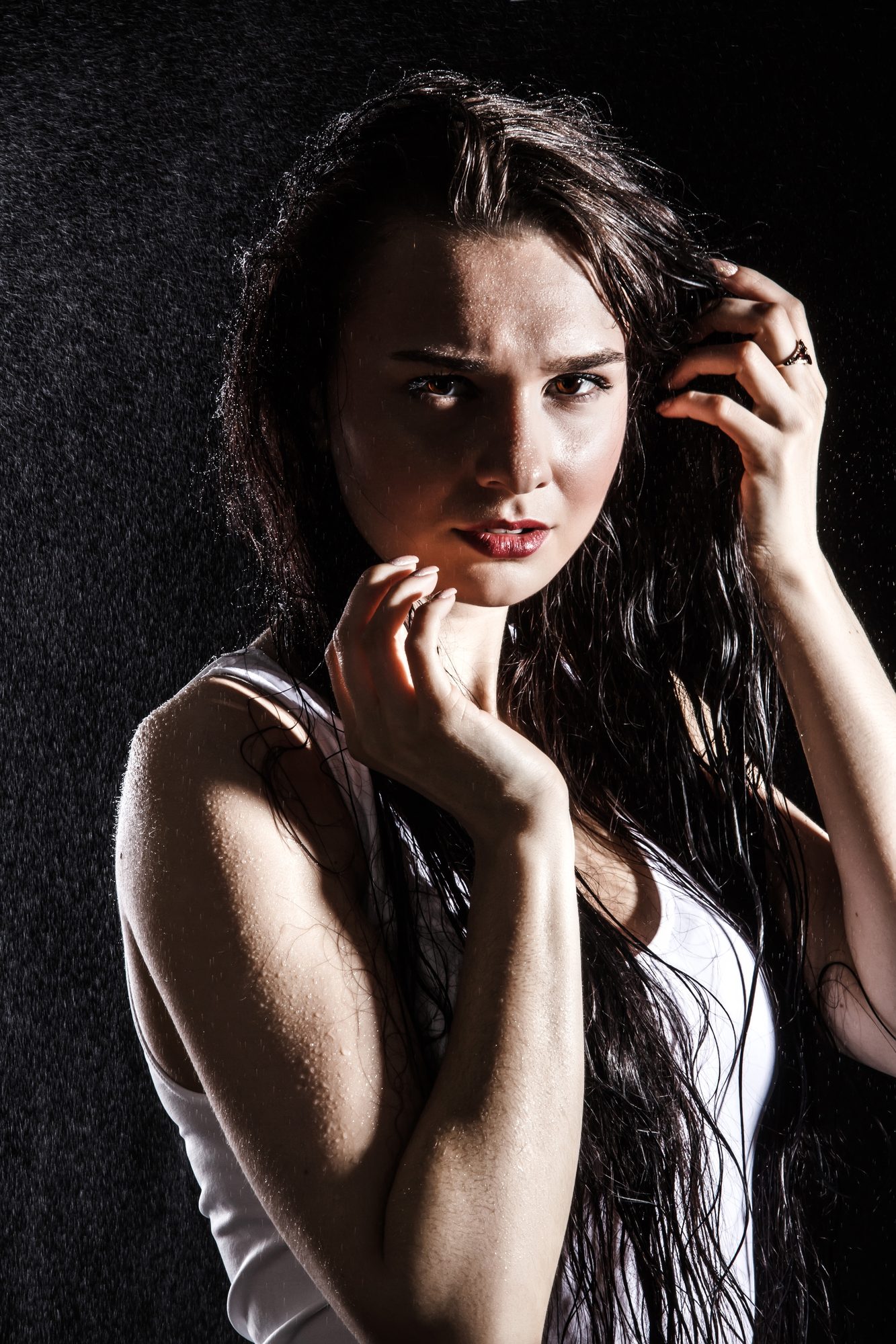 Dark haired woman looking into the camera anxiously
Picture from Depositphotos.com